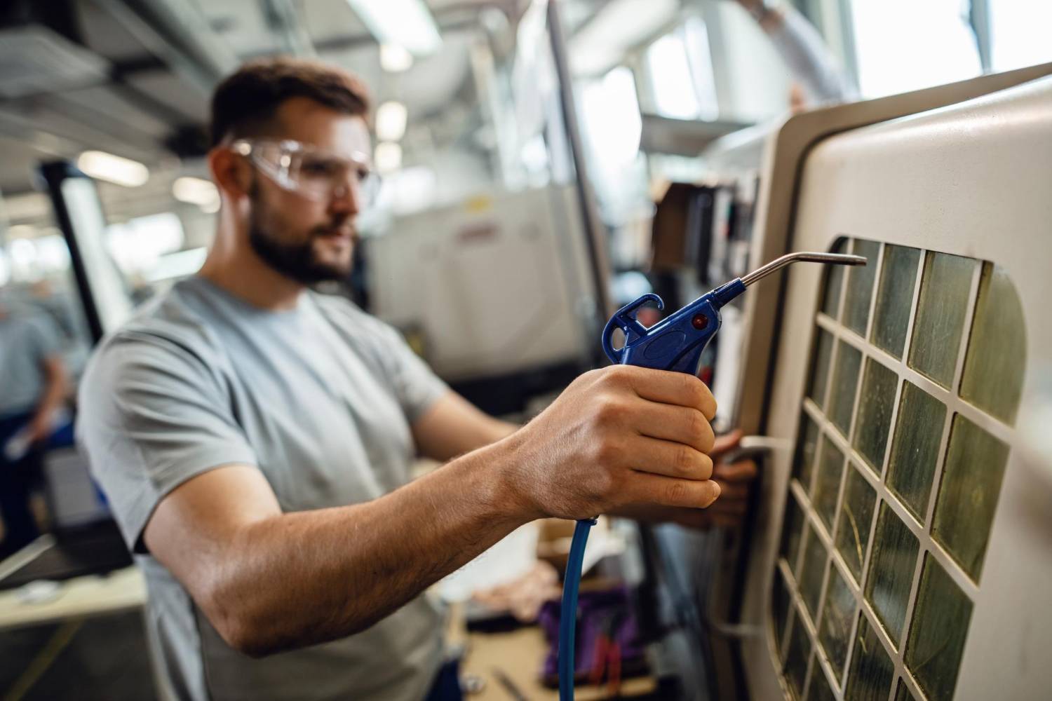 Technician diagnosing an air conditioner that is not cooling properly
