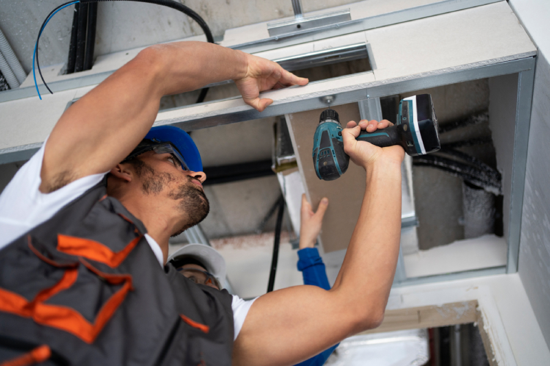 Technician installing a split air conditioner in Jeddah